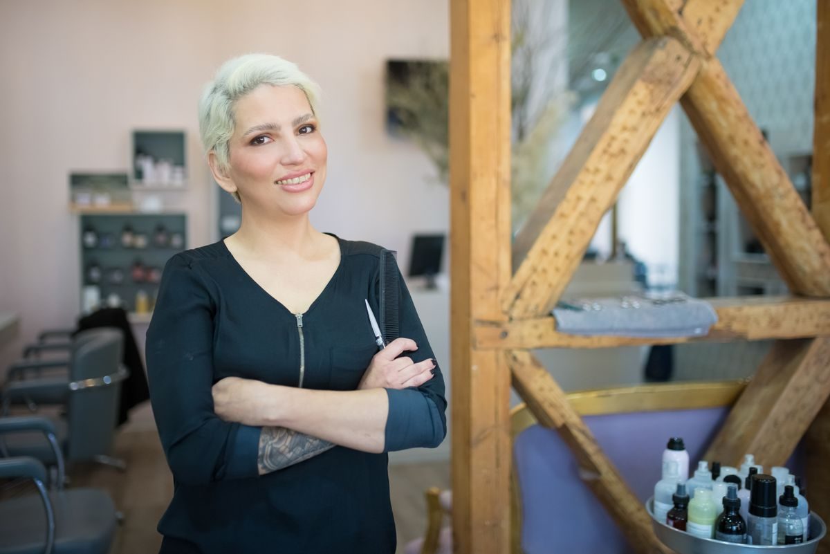 Salon owner standing in her salon