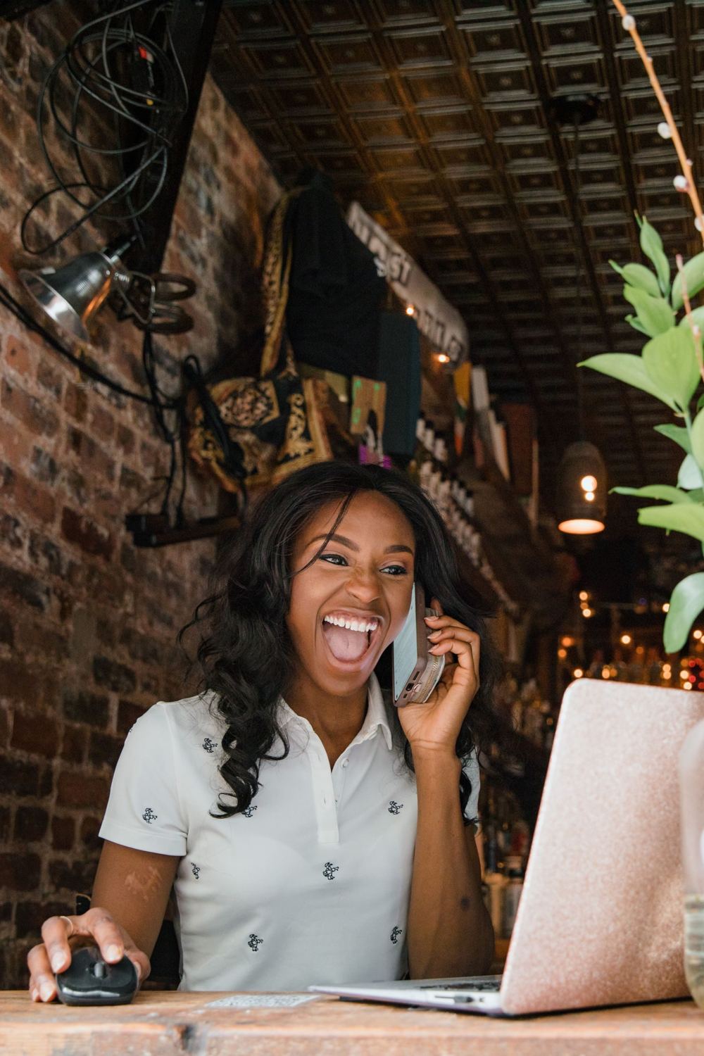 A woman laughing on the phone
