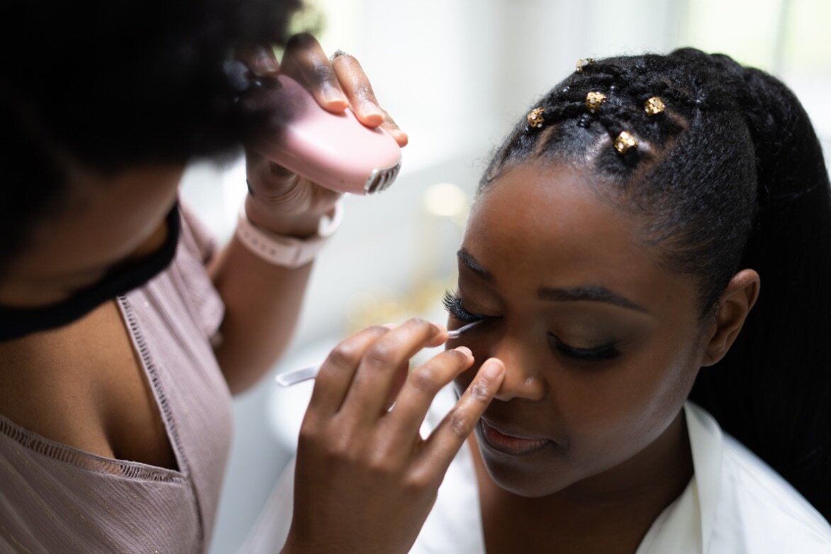 A woman having her makeup done