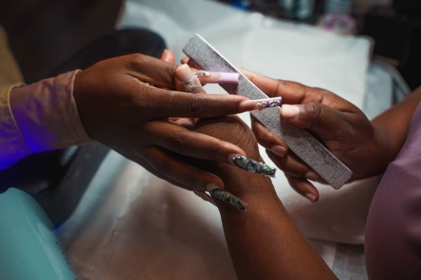 Nails being shaped at a salon